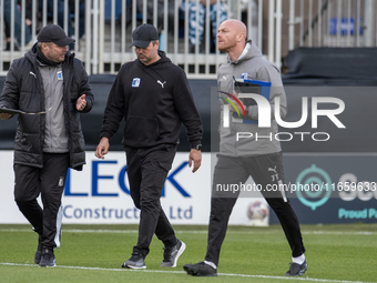 Barrow assistant manager Robbie Stockdale (left) converses with Barrow manager Stephen Clemence during the Sky Bet League 2 match between Ba...