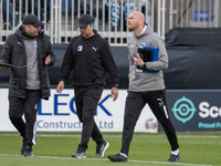 Barrow assistant manager Robbie Stockdale (left) converses with Barrow manager Stephen Clemence during the Sky Bet League 2 match between Ba...