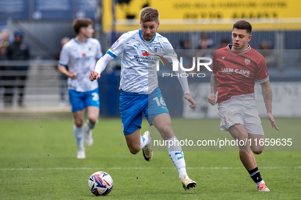 Sam Foley of Barrow competes with Adam Lewis of Morecambe during the Sky Bet League 2 match between Barrow and Morecambe at Holker Street in...