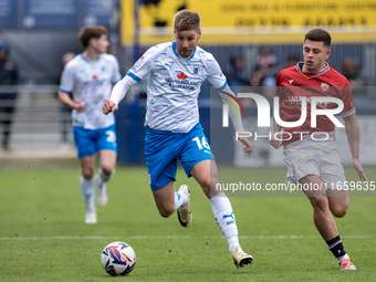 Sam Foley of Barrow competes with Adam Lewis of Morecambe during the Sky Bet League 2 match between Barrow and Morecambe at Holker Street in...