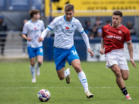 Sam Foley of Barrow competes with Adam Lewis of Morecambe during the Sky Bet League 2 match between Barrow and Morecambe at Holker Street in...