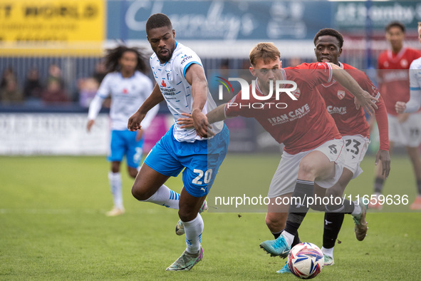 Barrow's Emile Acquah battles with Morecambe's Jamie Stott during the Sky Bet League 2 match between Barrow and Morecambe at Holker Street i...