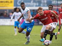 Barrow's Emile Acquah battles with Morecambe's Jamie Stott during the Sky Bet League 2 match between Barrow and Morecambe at Holker Street i...