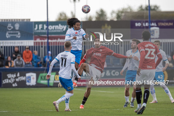 Barrow's Neo Eccleston challenges for a header with Morecambe's Marcus Dackers during the Sky Bet League 2 match between Barrow and Morecamb...