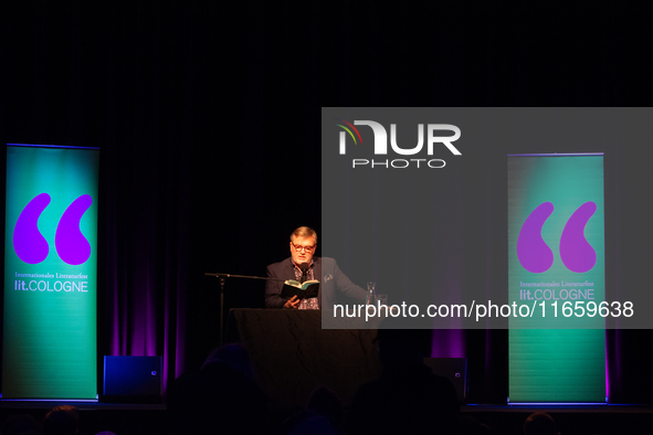 Hape Kerkeling, a German author, appears on the stage of the theater of Tanzbrunnen in Cologne, Germany, on October 12, 2024, during the lit...