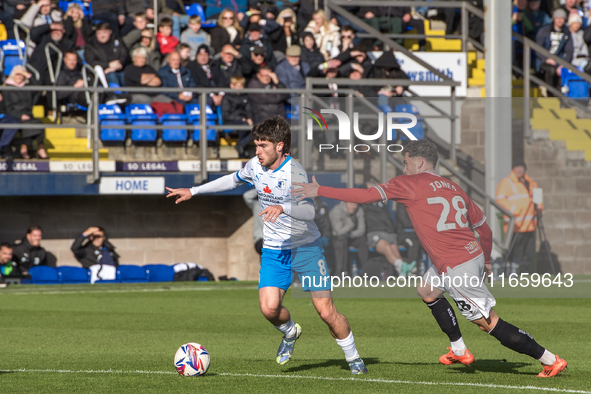 Kian Spence of Barrow competes with Callum Jones of Morecambe during the Sky Bet League 2 match between Barrow and Morecambe at Holker Stree...