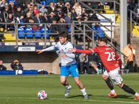 Kian Spence of Barrow competes with Callum Jones of Morecambe during the Sky Bet League 2 match between Barrow and Morecambe at Holker Stree...