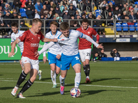 Ben Jackson of Barrow battles with Luke Hendrie of Morecambe during the Sky Bet League 2 match between Barrow and Morecambe at Holker Street...