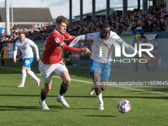 Katia Kouyate of Barrow battles with Ben Tollitt of Morecambe during the Sky Bet League 2 match between Barrow and Morecambe at Holker Stree...