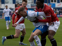 Elliot Newby of Barrow battles with David Tutonda of Morecambe during the Sky Bet League 2 match between Barrow and Morecambe at Holker Stre...