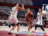 Umana Reyer's Davide Moretti competes against Virtus Bologna's Achille Polonara and Virtus Bologna's Ante Zizic during the Italian LBA baske...