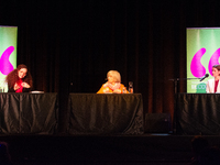 Shelly Kupferberg, a German journalist, Donna Leon, an American author, and Annett Renneberg, a German actress, are on the stage of the thea...