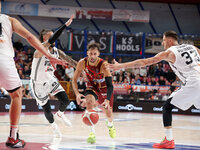 Umana Reyer's Davide Moretti competes against Virtus Bologna's Achille Polonara and Daniel Hackett during the Italian LBA basketball champio...