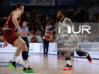 Rayjon Tucker of Virtus Bologna plays against Davide Casarin of Umana Reyer during the Italian LBA basketball championship match between Uma...