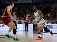 Rayjon Tucker of Virtus Bologna plays against Davide Casarin of Umana Reyer during the Italian LBA basketball championship match between Uma...