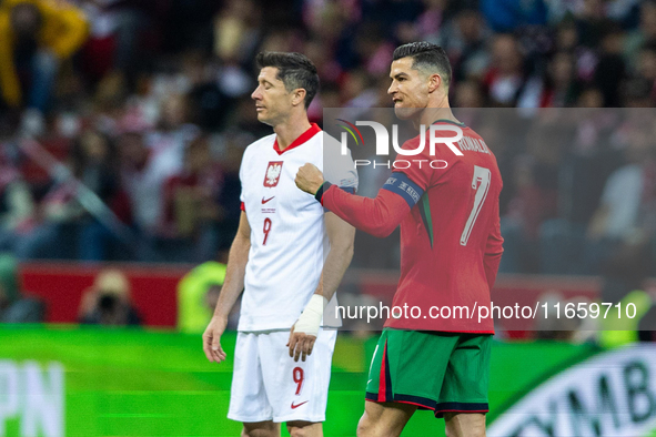 Cristiano Ronaldo reacts after scoring a goal while Robert Lewandowski looks on during the UEFA 2024 UEFA Nations League Group A1 match betw...