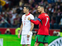 Cristiano Ronaldo reacts after scoring a goal while Robert Lewandowski looks on during the UEFA 2024 UEFA Nations League Group A1 match betw...