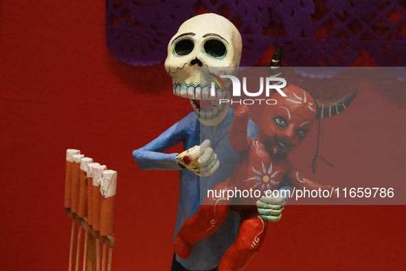 A skull and a little devil, made of cardboard, are at the exhibition ''The Other Life in Tamoanchan'' at the National Museum of Popular Cult...