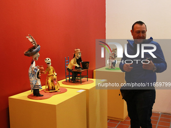 A man attends the exhibition ''The Other Life in Tamoanchan'' at the National Museum of Popular Cultures in Mexico City, Mexico, on October...