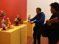 People look at the exhibition ''The Other Life in Tamoanchan'' at the National Museum of Popular Cultures in Mexico City, Mexico, on October...