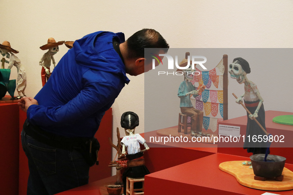 A man looks at the exhibition ''The Other Life in Tamoanchan'' at the National Museum of Popular Cultures in Mexico City, Mexico, on October...