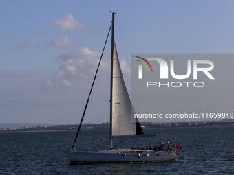 A sailboat is seen near Lisbon, Portugal, on October 12, 2024. Russian missile strikes on Ukrainian ports this week kill at least 10 people...