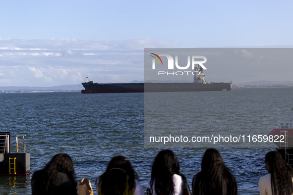 A cargo ship is seen near Lisbon, Portugal, on October 12, 2024. Russian missile strikes on Ukrainian ports this week kill at least 10 peopl...