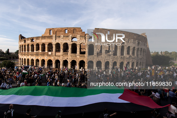 Members of the Palestinian student movement in Italy participate in a demonstration in the center of Rome to show their support for the Pale...