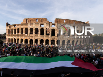 Members of the Palestinian student movement in Italy participate in a demonstration in the center of Rome to show their support for the Pale...