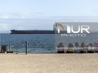 A cargo ship is seen near Lisbon, Portugal, on October 12, 2024. Russian missile strikes on Ukrainian ports this week kill at least 10 peopl...