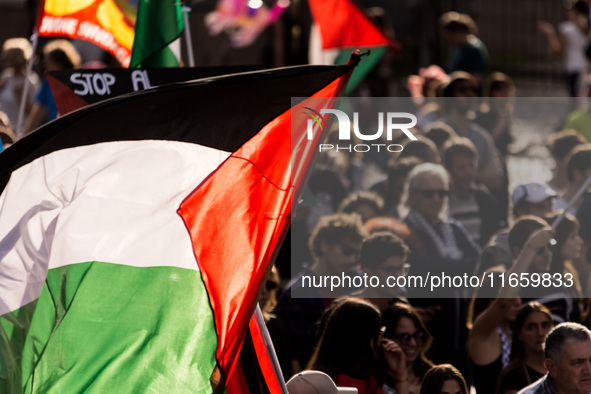 Members of the Palestinian student movement in Italy participate in a demonstration in the center of Rome to show their support for the Pale...