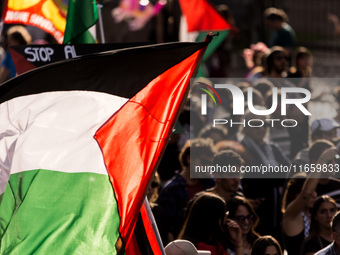 Members of the Palestinian student movement in Italy participate in a demonstration in the center of Rome to show their support for the Pale...