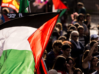 Members of the Palestinian student movement in Italy participate in a demonstration in the center of Rome to show their support for the Pale...