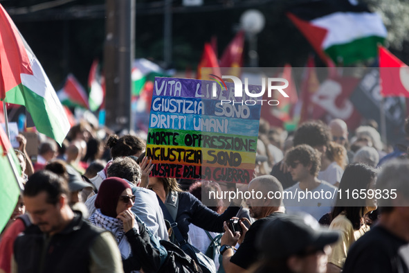 Members of the Palestinian student movement in Italy participate in a demonstration in the center of Rome to show their support for the Pale...