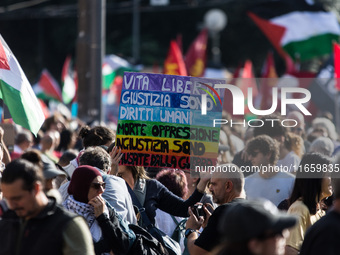 Members of the Palestinian student movement in Italy participate in a demonstration in the center of Rome to show their support for the Pale...