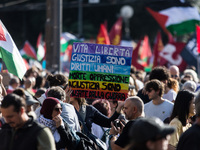 Members of the Palestinian student movement in Italy participate in a demonstration in the center of Rome to show their support for the Pale...