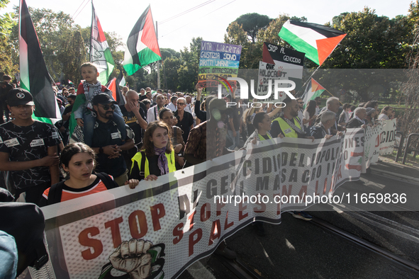 Members of the Palestinian student movement in Italy participate in a demonstration in the center of Rome to show their support for the Pale...