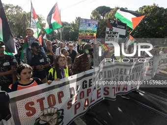 Members of the Palestinian student movement in Italy participate in a demonstration in the center of Rome to show their support for the Pale...