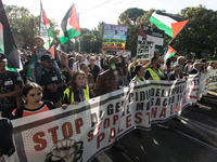 Members of the Palestinian student movement in Italy participate in a demonstration in the center of Rome to show their support for the Pale...