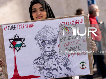 Members of the Palestinian student movement in Italy participate in a demonstration in the center of Rome to show their support for the Pale...