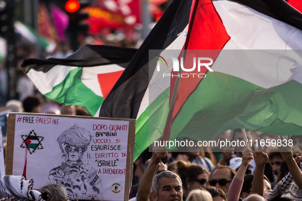 Members of the Palestinian student movement in Italy participate in a demonstration in the center of Rome to show their support for the Pale...