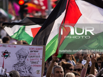 Members of the Palestinian student movement in Italy participate in a demonstration in the center of Rome to show their support for the Pale...