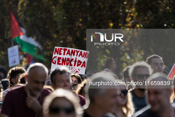 Members of the Palestinian student movement in Italy participate in a demonstration in the center of Rome to show their support for the Pale...