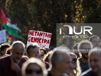 Members of the Palestinian student movement in Italy participate in a demonstration in the center of Rome to show their support for the Pale...