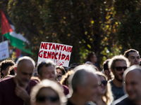 Members of the Palestinian student movement in Italy participate in a demonstration in the center of Rome to show their support for the Pale...