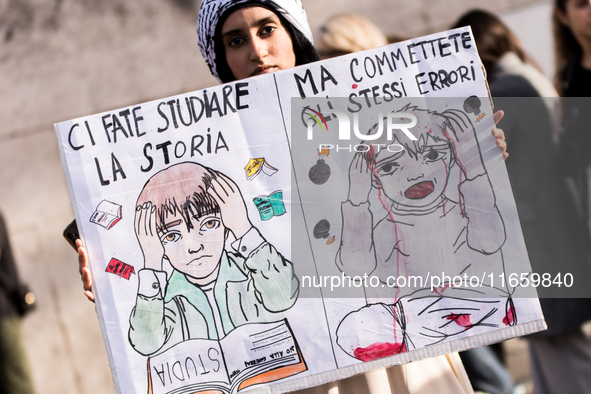 Members of the Palestinian student movement in Italy participate in a demonstration in the center of Rome to show their support for the Pale...