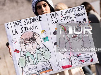 Members of the Palestinian student movement in Italy participate in a demonstration in the center of Rome to show their support for the Pale...