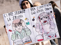 Members of the Palestinian student movement in Italy participate in a demonstration in the center of Rome to show their support for the Pale...