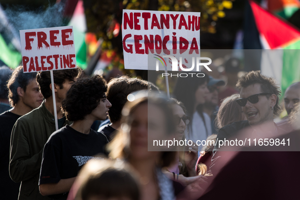 Members of the Palestinian student movement in Italy participate in a demonstration in the center of Rome to show their support for the Pale...