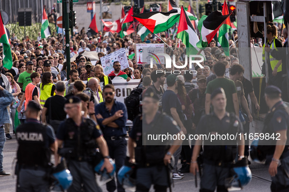 Members of the Palestinian student movement in Italy participate in a demonstration in the center of Rome to show their support for the Pale...